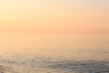 Calm ocean or sea water in beautiful warm sunset colors Royalty Free Stock Photo