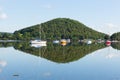 Calm peaceful relaxed morning on a still day at a beautiful lake with cloud reflections Royalty Free Stock Photo