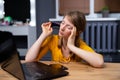 Calm peaceful young woman relaxing in office chair at workplace, tired employee sitting at desk, female student taking break after Royalty Free Stock Photo