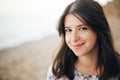 Calm portrait of happy fashionable boho woman relaxing at sandy cliff on tropical island. Stylish hipster girl walking on beach at Royalty Free Stock Photo