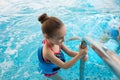 Girl learning to swim