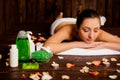 Calm pretty young woman laying in spa salon with closed eyes and relaxed Royalty Free Stock Photo