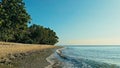 Calm and relaxing aerial drone image of a stunning beautiful hidden remote ocean sea shore at sunset with an endless sandy beach Royalty Free Stock Photo