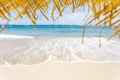 Calm and relaxing empty beach scene, blue sky and white sand. Royalty Free Stock Photo