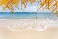 Calm and relaxing empty beach scene, blue sky and white sand. Royalty Free Stock Photo