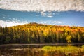 Calm river with colorful mountain foliage in background Royalty Free Stock Photo