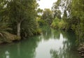 The calm running River Jordan at the Yardenit Baptismal Site the traditional place of John the Baptist and his ministry Royalty Free Stock Photo