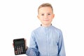 Calm Schoolboy holding calculator. Portrait of funny cute 10s boy .White background