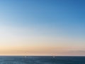 Calm sea and cloudless orange evening sky Royalty Free Stock Photo