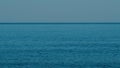 Calm Sea Horizon Background. Calm Blue Ocean Beach Water With Clear Blue Sky. Royalty Free Stock Photo