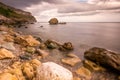 Rocky, rugged coastline at Llandudno, North Wales. Wet rocks and smooth sea at the beach