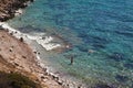 Calm sea or ocean wave on the beach by the sea, people swimming in the sea, Turkey Datca Knidos