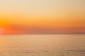 Calm Sea Or Ocean And Yellow Clear Sunset Or Sunrise Sky Background