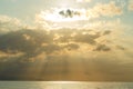 Calm sea with sunset sky and sun through the clouds over. Meditation ocean and sky background. Tranquil seascape Royalty Free Stock Photo