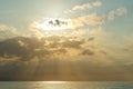 Calm sea with sunset sky and sun through the clouds over. Meditation ocean and sky background. Tranquil seascape Royalty Free Stock Photo