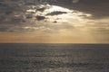 Calm sea with sunset sky and sun through the clouds over. Meditation ocean and sky background. Tranquil seascape. Royalty Free Stock Photo