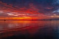 Calm sea with sunset sky and sun through the clouds over. Ocean and sky background, seascape bali. Royalty Free Stock Photo