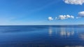 Calm sea in Sweden with clouds reflecting Royalty Free Stock Photo