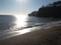 Calm sea waves against a sunny winter sky Coryton Cove Beach, Dawlish Devon