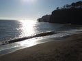 Calm sea waves against a sunny winter sky Coryton Cove Beach, Dawlish Devon