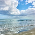 Calm sea and white heap clouds