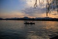 A calm seascape with mountains at sunset. Dramatic sky and cloudscape Royalty Free Stock Photo