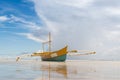Calm seashore view low tide with boat Royalty Free Stock Photo