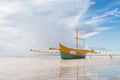 Calm seashore view low tide with boat Royalty Free Stock Photo