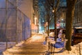 Calm and serene night scene showing an empty and quiet street in New York City`s Harlem neighborhood Royalty Free Stock Photo