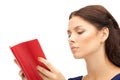 Calm and serious woman with book