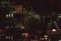 Calm shady interior of an outdoor cafe terrace