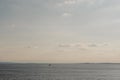 Calm sky and sea at sunset, unidentified boat in the distance Royalty Free Stock Photo