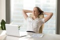 Calm smiling businesswoman relaxing at comfortable chair hands b Royalty Free Stock Photo