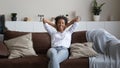 Happy ethnic woman relax on sofa taking nap Royalty Free Stock Photo