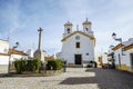 Small square with a church in traditional village  Vila Fernando  Alentejo  Portugal Royalty Free Stock Photo