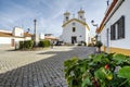 Small square with a church in traditional village  Vila Fernando  Alentejo  Portugal Royalty Free Stock Photo