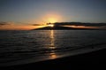 Calm sunset with a reflection in Maui Hawaii from the beach Royalty Free Stock Photo
