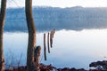 Calm or tranquility of water on wide river in the early morning. Calm surface of river with high opposite bank in blue haze, flood