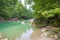 Calm, turquoise or emerald colored water in a gorge in Tirol, Austria