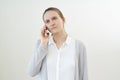 Calm, unemotional woman talks on phone, listens to other person, does not react