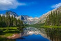 0000296_A calm view of lake Josephine along the Grinnell Glacier Trail, Glacier National Park, Montana with the Salamander Glacier Royalty Free Stock Photo