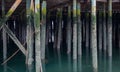 Calm Water Around Pylons Underneath Pier Royalty Free Stock Photo