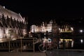 Calm water canal and old medieval buildings at night, Ghent, Belgium