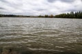 Calm water on the lake and forest background Royalty Free Stock Photo