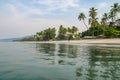 Calm water, palm trees and white sand beach at Tokeh Beach, south of Freetown, Sierra Leone, Africa Royalty Free Stock Photo