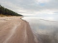 Calm water of Riga gulf, Sandy beach and cloudy sky, Nobody, Latvia. Jurmala region