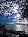 calm waters anchored boats and clear skies Royalty Free Stock Photo