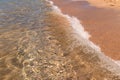 Calm wave of the sea on a golden sandy beach. Seaside holidays and vacations