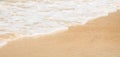 Calm waves on a sandy beach