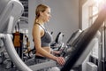 Calm woman hearing song on treadmill